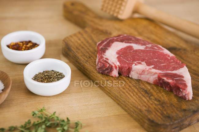 Steak with Tenderizer and Spices — Stock Photo
