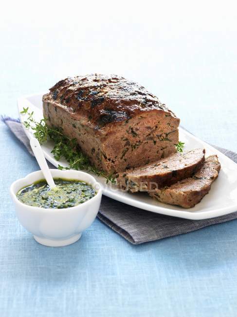 Meatloaf with herb sauce — Stock Photo