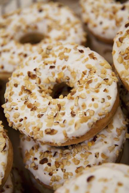 Donuts sprinkled with chopped hazel nuts — Stock Photo