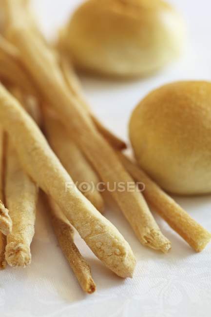 Grissini and bread rolls — Stock Photo