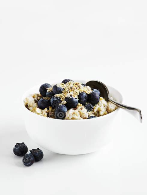 Porridge with blueberries and muesli — Stock Photo
