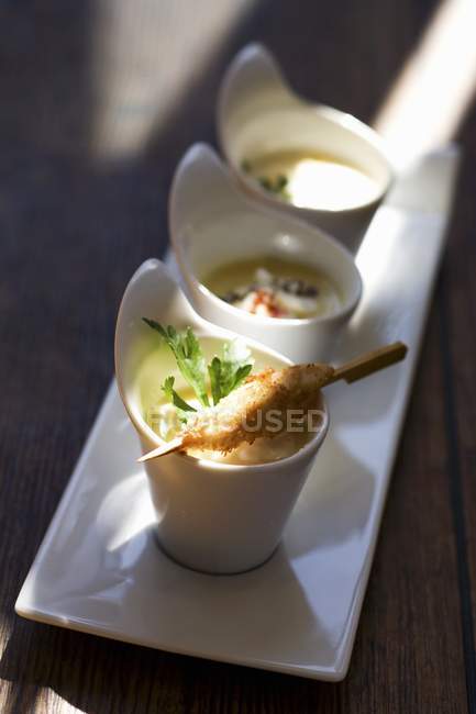 Curry soup with asparagus and pepper in small saucers — Stock Photo