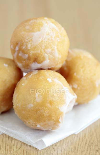 Closeup view of fried dough balls with icing sugar — Stock Photo