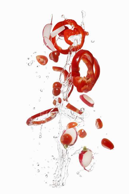 Tomatoes and radishes washed — Stock Photo