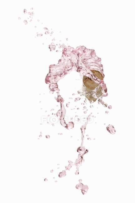 Splash of rose wine — Stock Photo