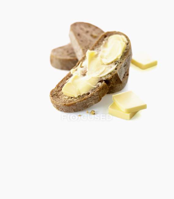 Bread slices and butter — Stock Photo