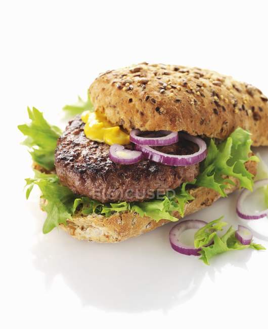 Hamburger with onions and lettuce — Stock Photo