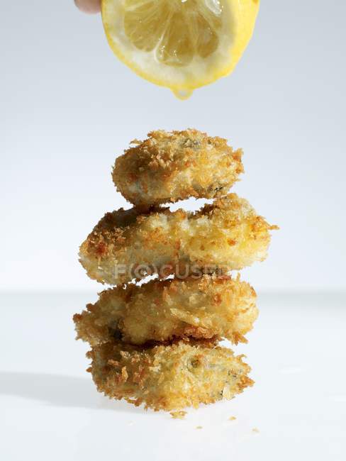 Pile of breaded oysters — Stock Photo