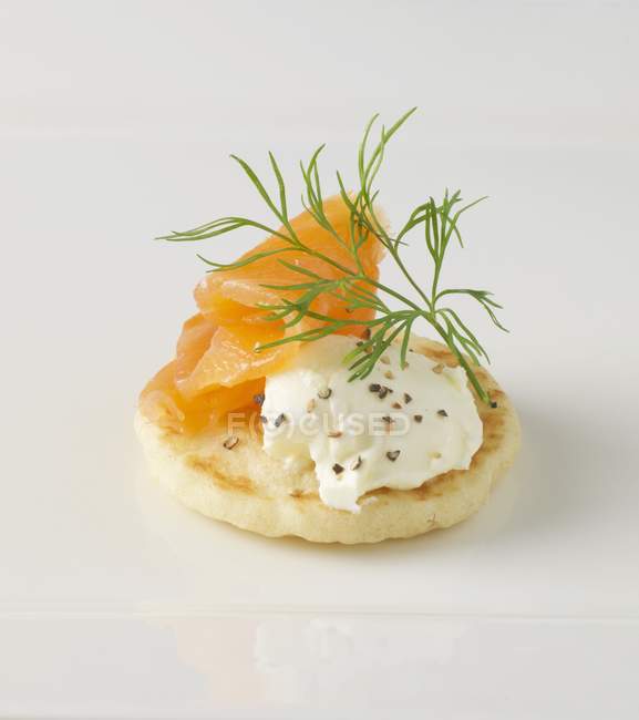 Blini with cream cheese and smoked salmon — Stock Photo
