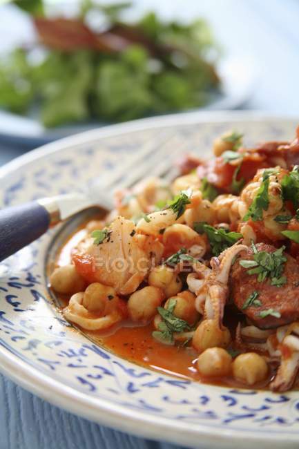Chickpea stew with seafood — Stock Photo