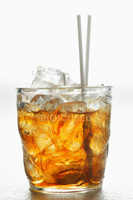 Iced tea in glass with straws — Stock Photo