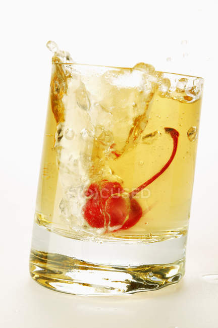 Ginger Ale with cocktail cherry — Stock Photo