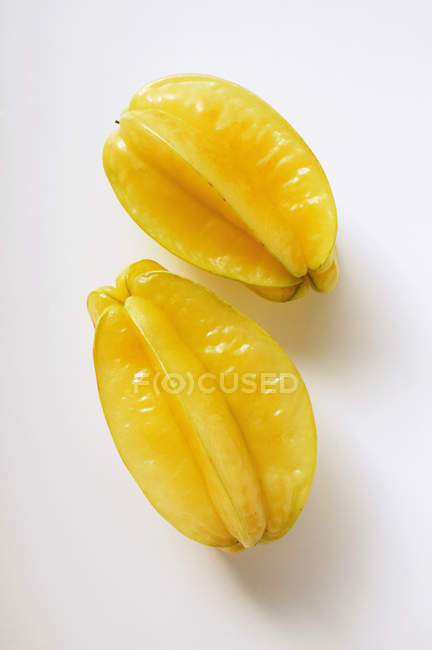 Two yellow carambolas — Stock Photo