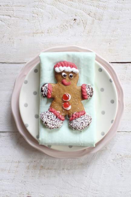 Top view of decorated gingerbread man on plate — Stock Photo