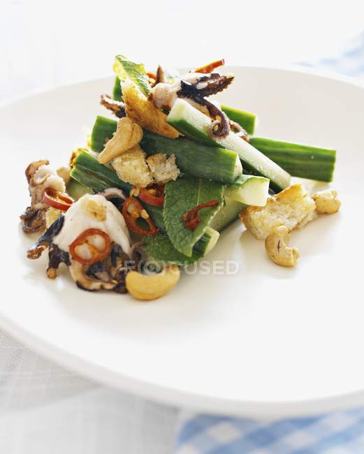 Octopus salad with cucumber — Stock Photo