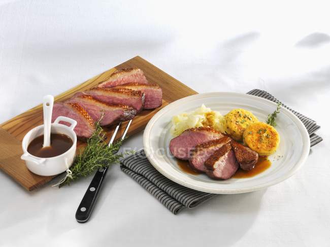 Duck breast with fried potatoes — Stock Photo