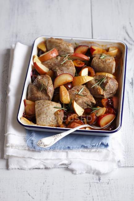 Pork with plums and rosemary — Stock Photo