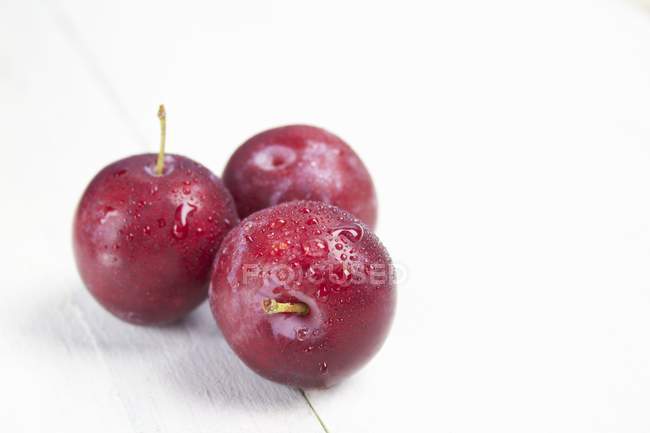 Fresh ripe red plums — Stock Photo