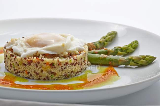 Quinoa timbale with fried egg — Stock Photo