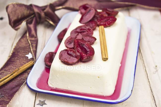 Panna cotta dessert with plums — Stock Photo
