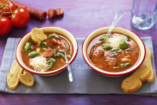 Minestrone with chorizo with spoons — Stock Photo