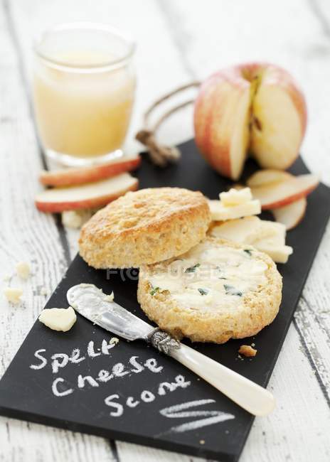 Cheese scone and apple juice — Stock Photo