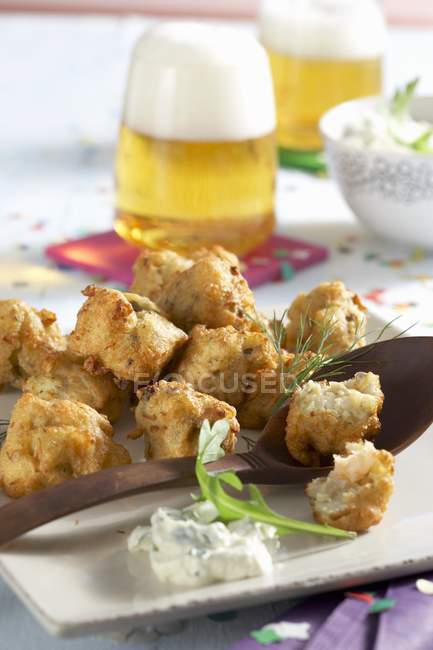 Closeup view of spicy crab fritters with rocket dip — Stock Photo