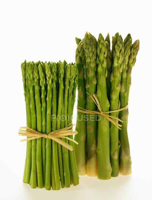 Bundles of green and Thai asparagus — Stock Photo