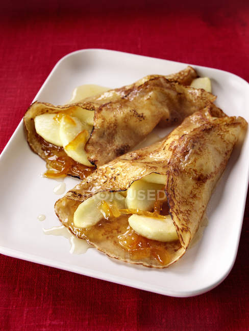 Pancakes with apples and orange — Stock Photo