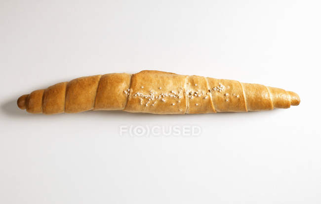 Closeup view of one salted stick on white surface — Stock Photo