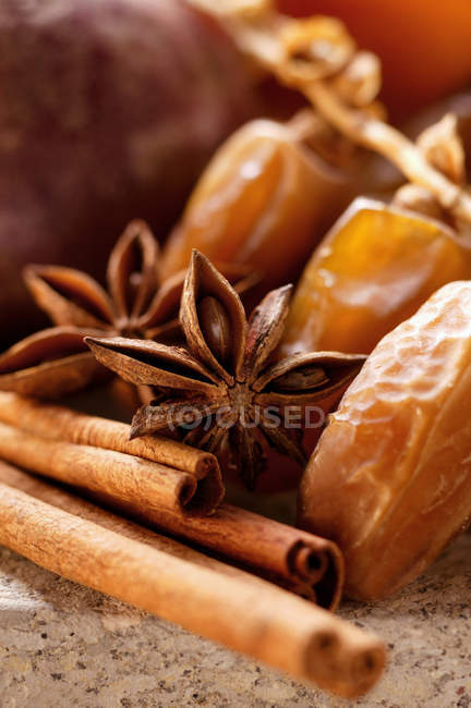Dates with star anise and cinnamon — Stock Photo