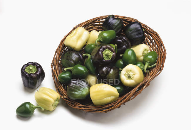 Basket of assorted mini-peppers — Stock Photo