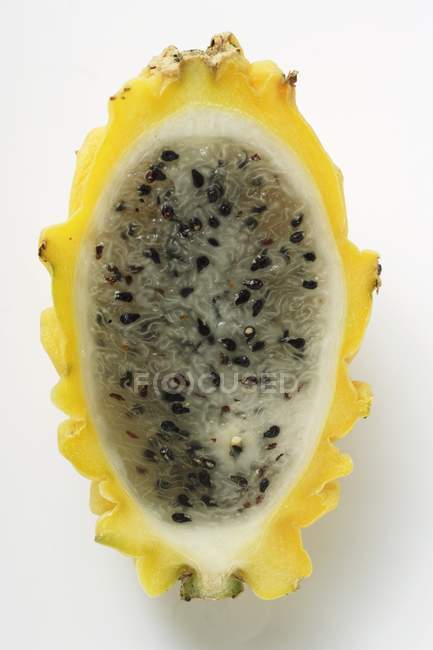 Half of fresh yellow pitahaya — Stock Photo