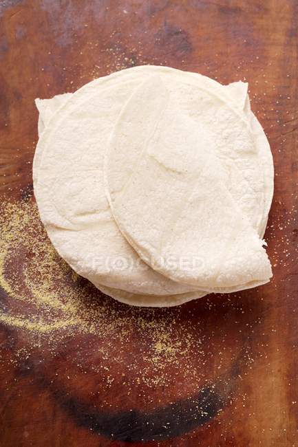 Top view of wheat Tortillas on wooden background — Stock Photo