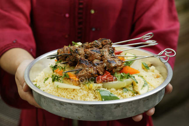 Person serving kebabs — Stock Photo