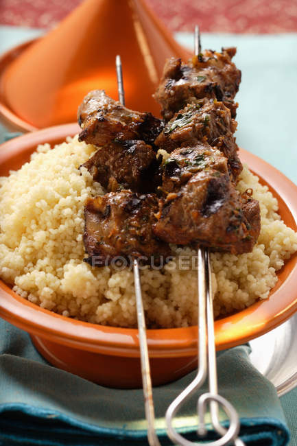 Spicy kebabs on couscous — Stock Photo