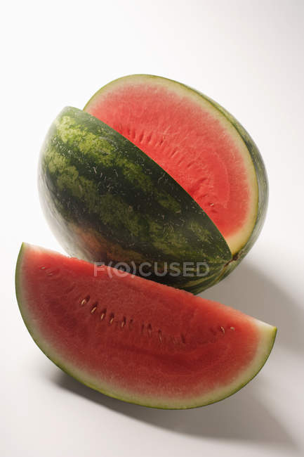 Watermelon with slice cut out — Stock Photo