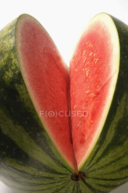 Watermelon with slice cut out — Stock Photo