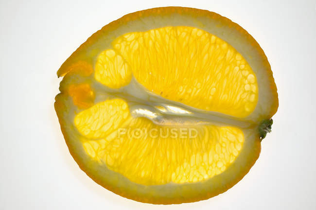 Lengthwise orange slice — стоковое фото