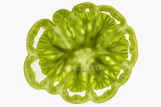 Rebanada de tomate verde - foto de stock