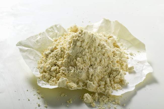 Chick-pea flour on paper — Stock Photo