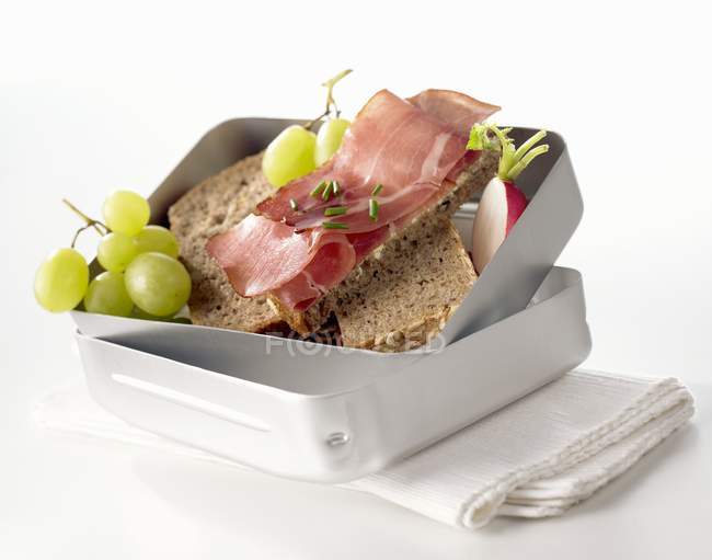 Ham sandwiches in box — Stock Photo