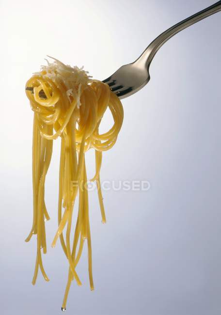 Spaghetti with Parmesan on fork — Stock Photo