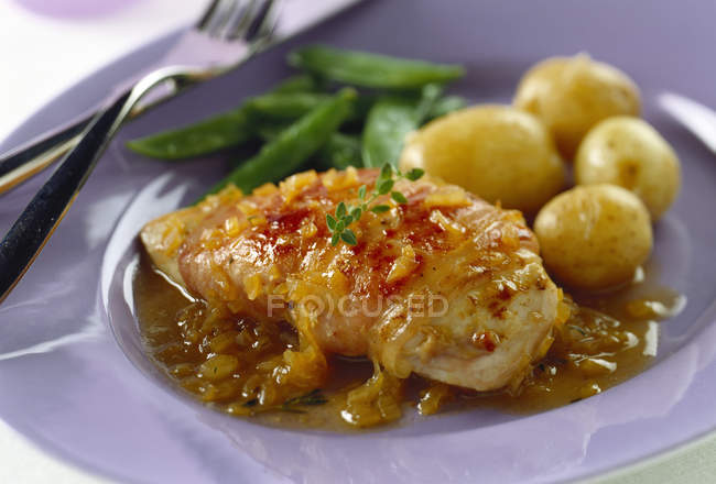 Chicken breast in ham with potatoes — Stock Photo