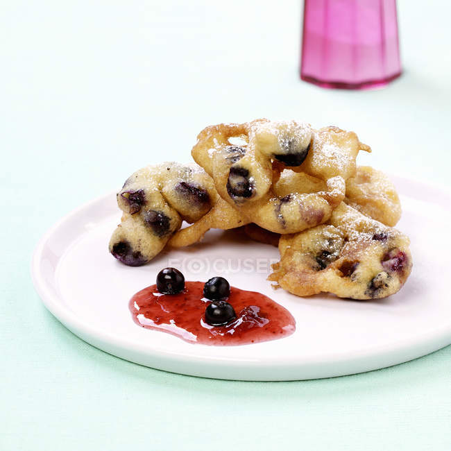 Deep-fried pastries with blueberries — Stock Photo