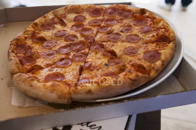 Pepperoni pizza in pizza box — Stock Photo