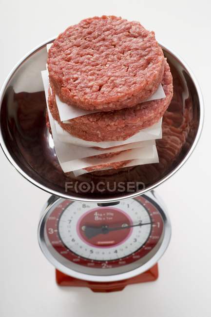 Pile of raw beef burgers for hamburgers — Stock Photo