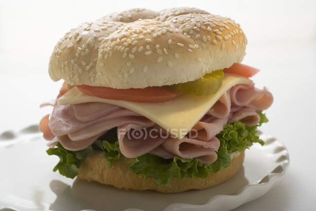 Sesame roll with ham — Stock Photo