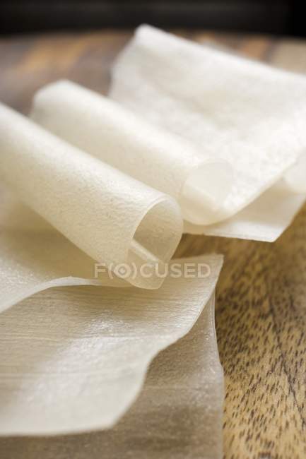 Rice noodles on wooden plate — Stock Photo