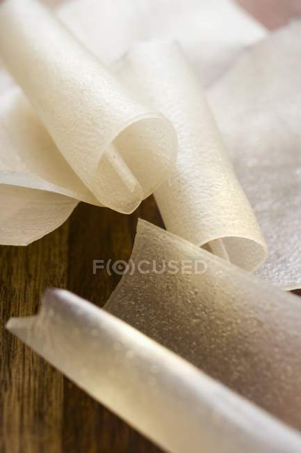 Rice noodles on wooden background — Stock Photo